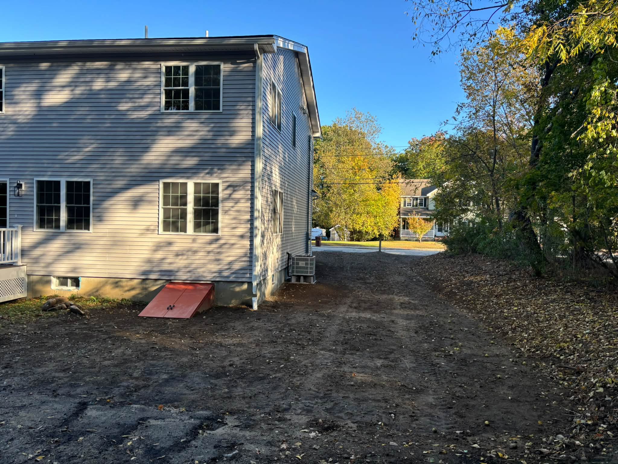 Corrected grade directing water away from home — Auburn, MA